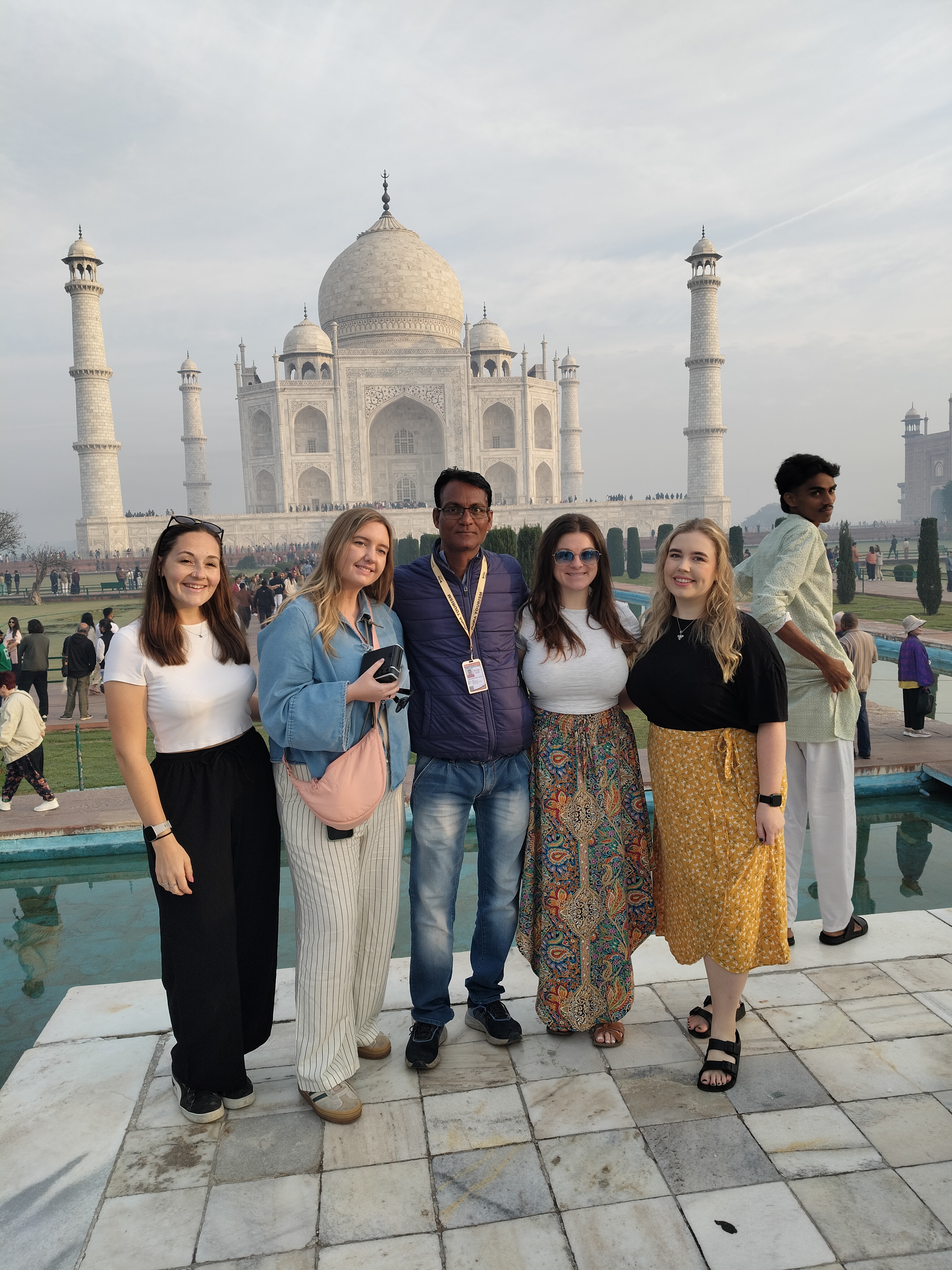 Mr. Verma with tourists smiling